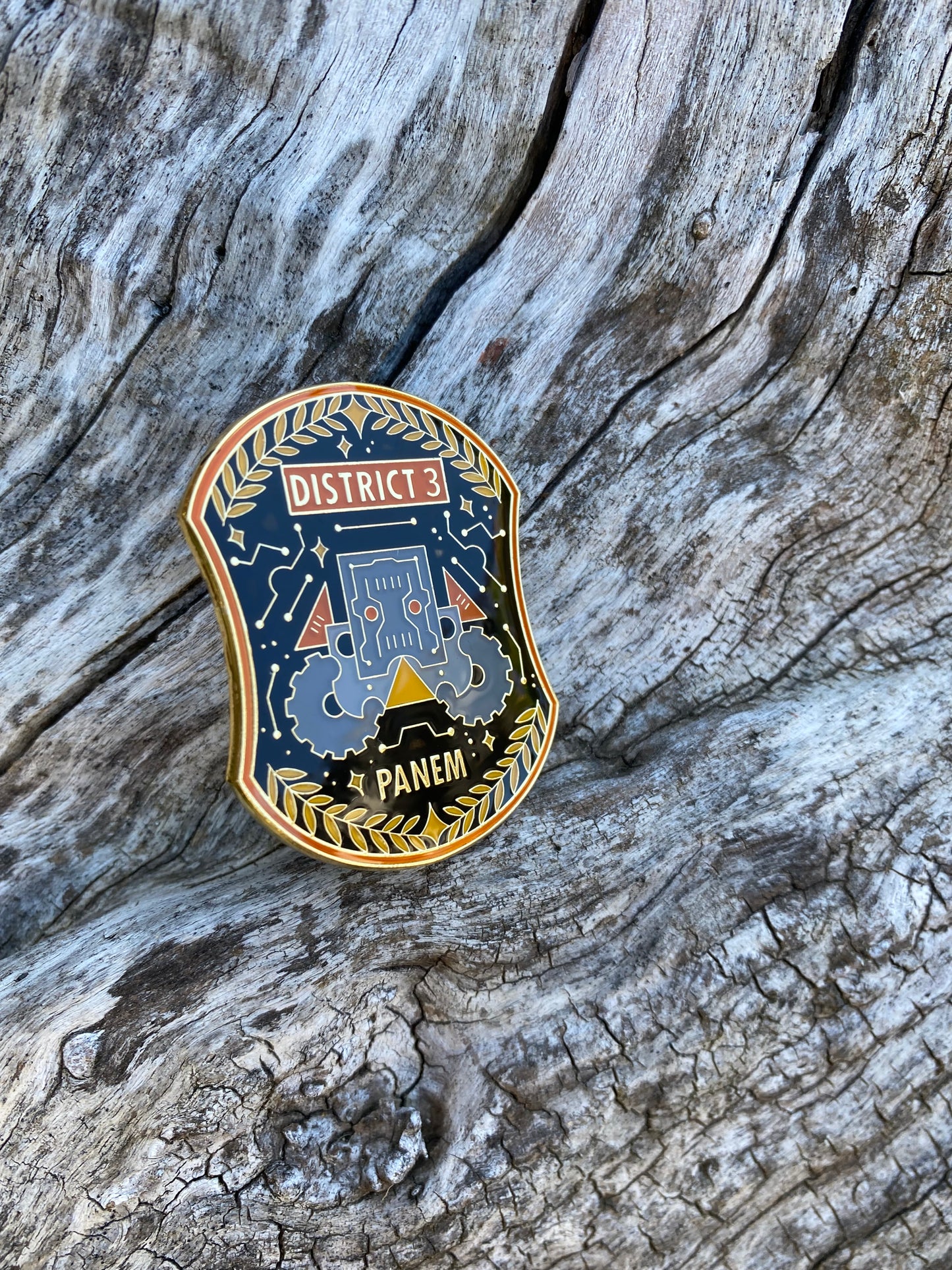 The Hunger Games District 3 Enamel Pin