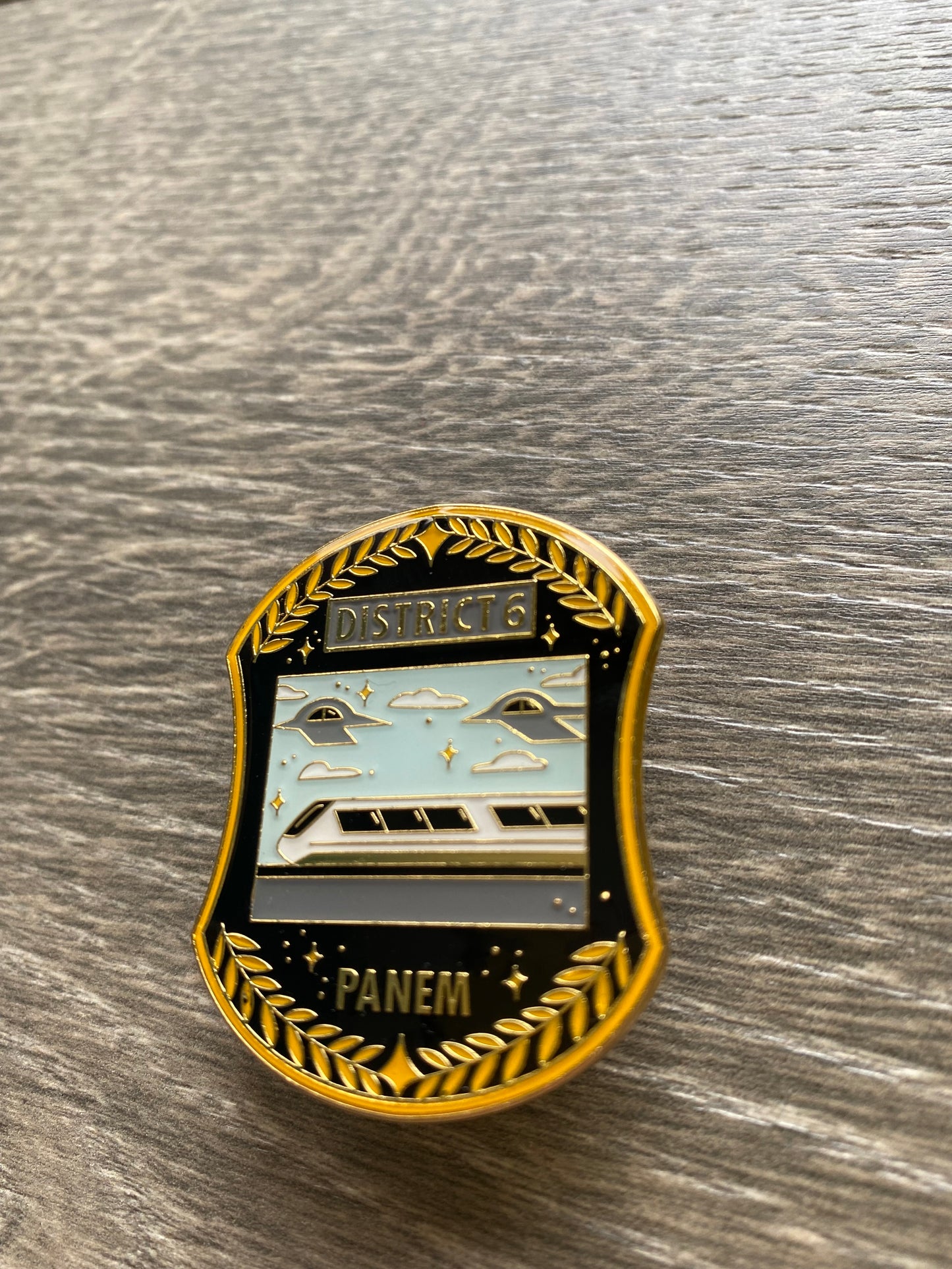 District 6 Hunger Games Enamel Pin