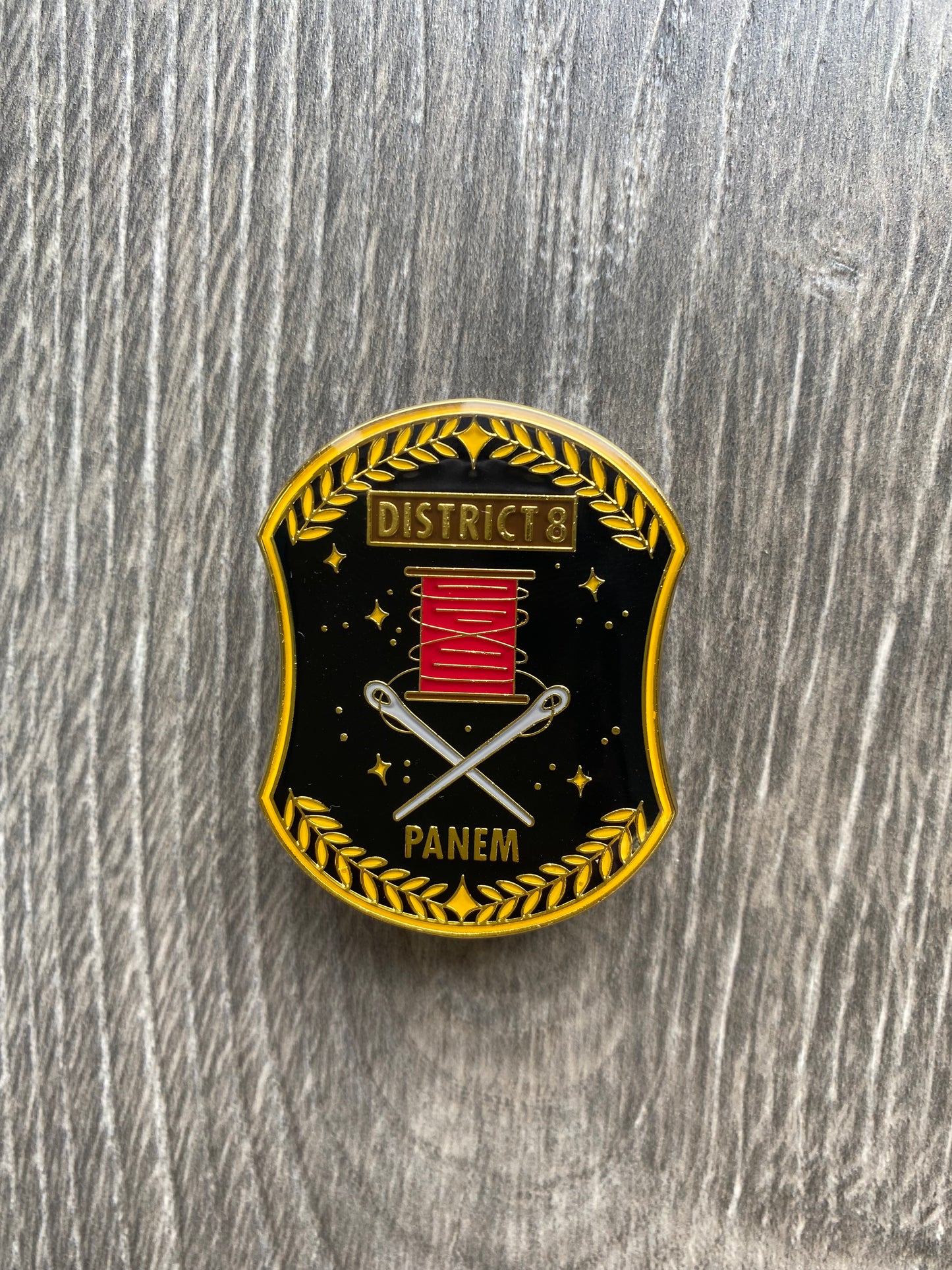 District 8 The Hunger Games Enamel Pin
