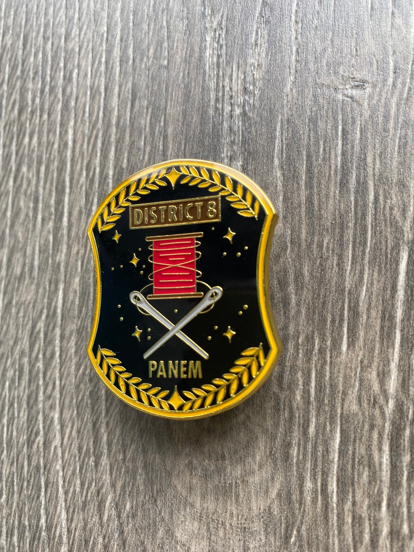 District 8 The Hunger Games Enamel Pin